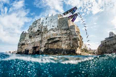 Jacqueline Valente dives from the 22-metre platform during the first training session of the seventh stop of the Red Bull Cliff Diving World Series, Polignano a Mare, on September 11, 2015.