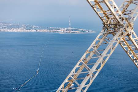 Jaan Roose's slackline was spanned between two old power pylons at the Messina Strait 