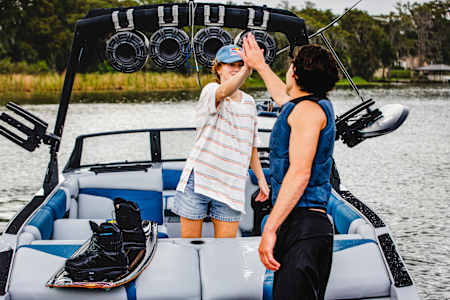 Meagan and Guenther share a high-five on the water. 