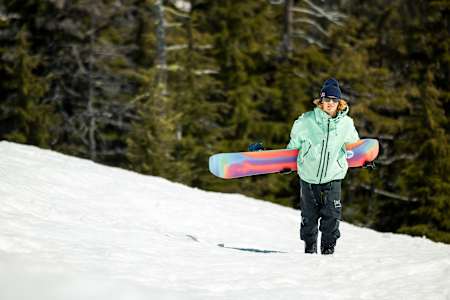 Brock Crouch hikes a feature at Landing Gear, Mt Bachelor