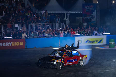 On August 10, 2025, Boksie wows fans with an adrenaline-fueled car stunt at Red Bull Shayimoto in Suncoast, Durban, South Africa, surrounded by an electrified audience and smoky drifts