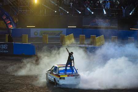 Panjaro thrills the crowd with a daring rooftop stunt amid tyre smoke at Red Bull Shayimoto 2025 in Suncoast, Durban, South Africa, igniting the atmosphere with high-octane energy