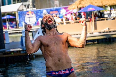 Cătălin Preda of Romania triumphantly reacts after his final 27-metre dive at the Red Bull Cliff Diving World Series 2025 in Boston, showcasing pure adrenaline and Red Bull spirit