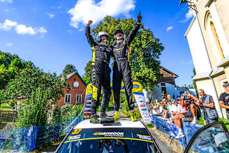 Junior ERC champion Carlberg is embraced by co-driving father Torbjörn