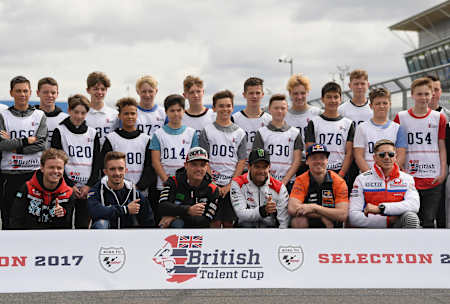 Riders from the British Talent Cup line up for a photo with MotoGP stars.