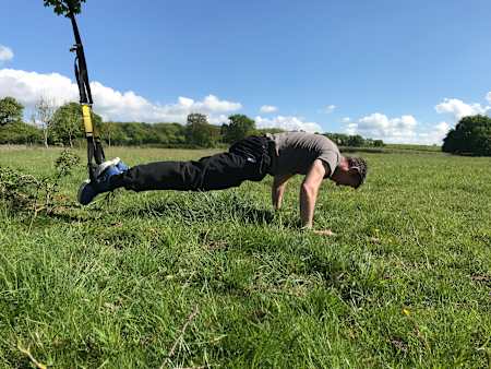 How to perform a pike using a TRX