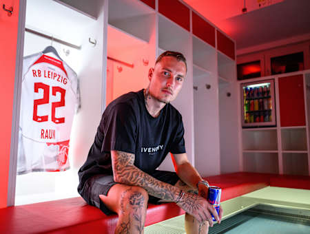 David Raum poses in front of his shirt after signing for German side Red Bull Leipzig. 