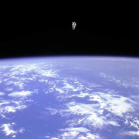 Bruce McCandless flying through space