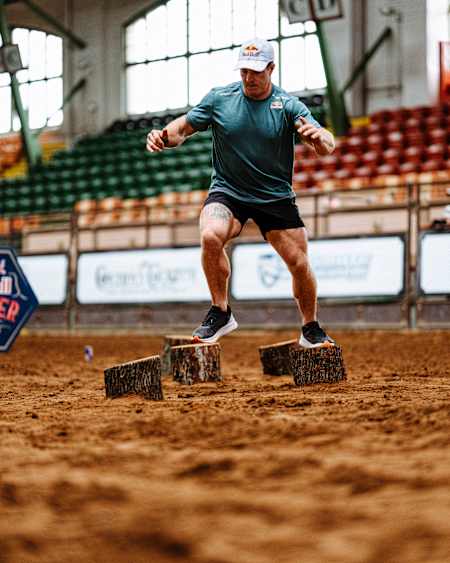 Noah Ohlsen running through tree stampede