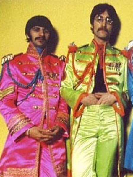 The Beatles line up in their Sgt Pepper costumes
