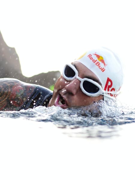 Josef grabs a mouthful of air, mid-swim.
