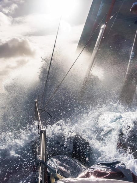 A wave crashes over Team SCA in the Southern Ocean