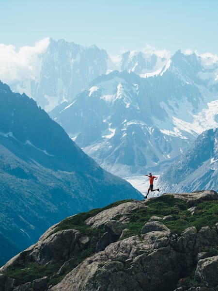 Ryan Sandes runs with dramatic mountains behind him in Chamonix, France.