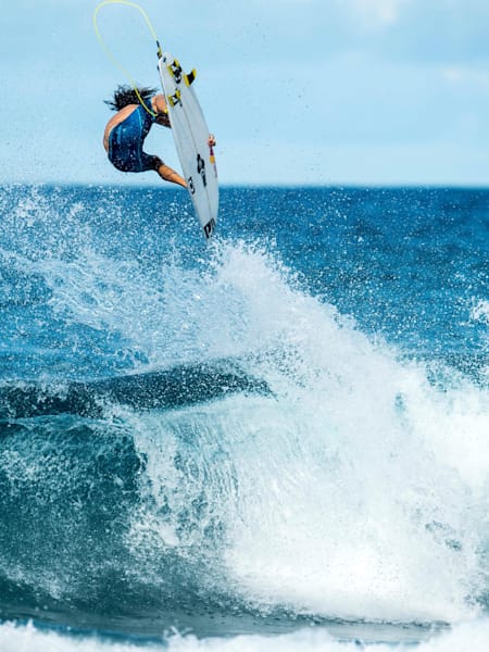 Surfer Jordy Smith does an air at Rocky Point on The North Shore of Oahu, Hawaii