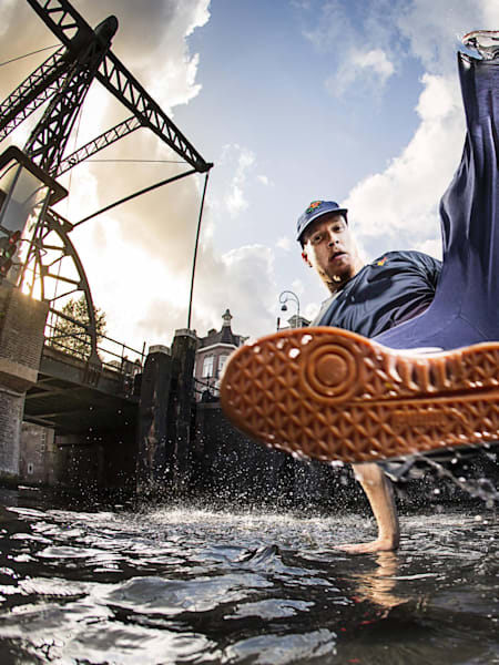 B-Boy Menno strikes a poses in a stream.