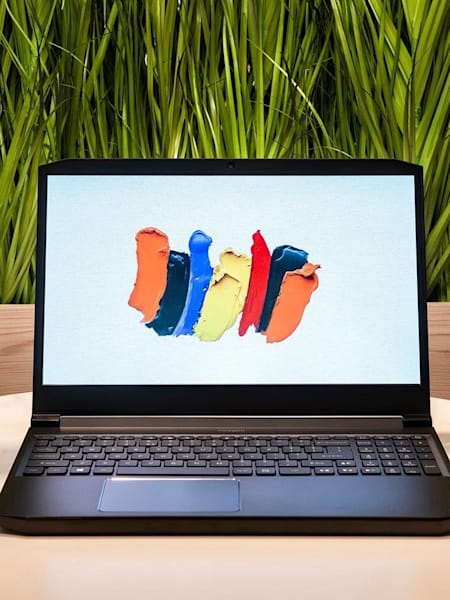 A front shot of the ConceptD 5 with a can of Red Bull