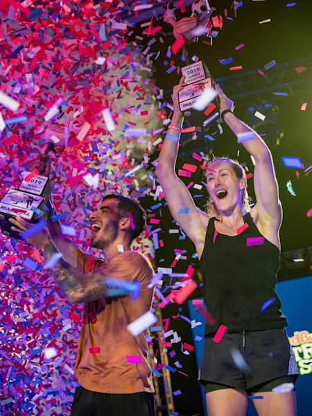 Ricardo Chahini de Araújo of Brazil (L) and Mélody Donchet of France celebrate during the Red Bull Street Style World Final at Wynwood Marketplace, Miami, USA on November 15, 2019.