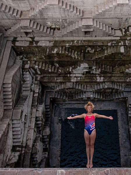 Rhiannan Iffland of Australia, dives at the Toorji Ka Jhalra stepwell in Jodphur, India on November 20, 2019.
