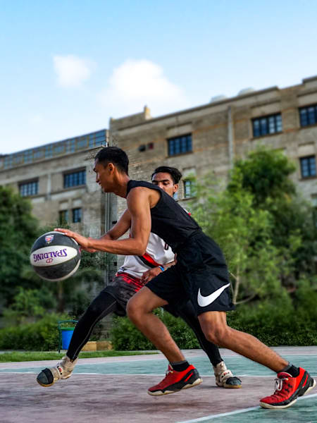 Kenneth and Ammar at a local basketball court in Karachi.