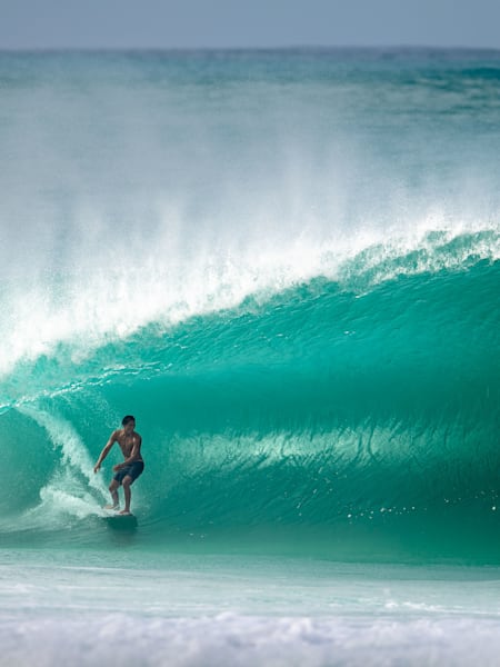 Barron Mamiya catching waves at Log Cabins, USA