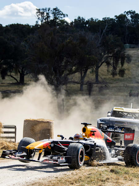 Daniel Ricciardo in the RB7 Formula 1 car and Toby Price in his trophy Ruck