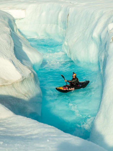 Aniol Serrasolses paddles the river on the Austfonna ice cap, Svalbard