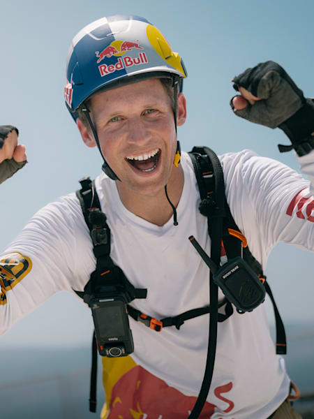 Jaan Roose celebrates crossing the Messina Strait on a slackliner in a world record attempt 