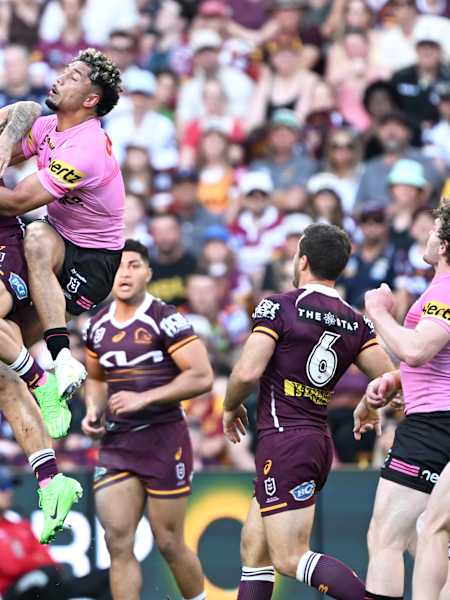 Reece Walsh and Izack Tago meet in the air