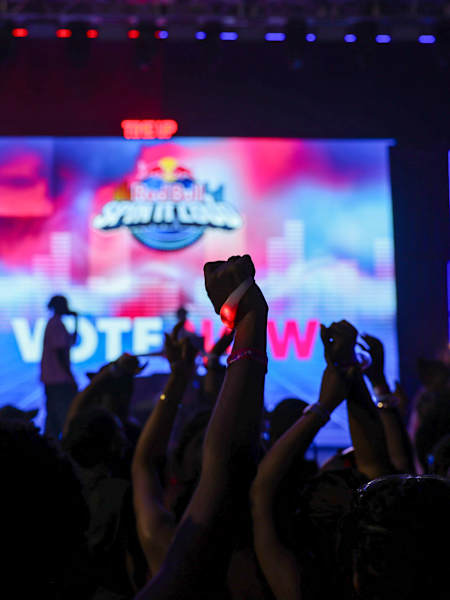 Fans passionately cast their votes during Red Bull Spin it Loud in Lagos, Nigeria on December 12, 2024, celebrating electrifying music and vibrant Red Bull energy