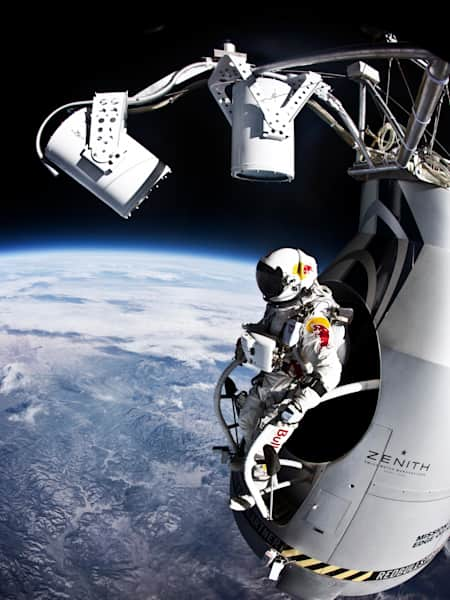 Pilot Felix Baumgartner stands outside the Red Bull Stratos capsule.