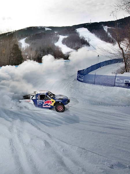 Desert truck racers in snow at Red Bull Frozen Rush