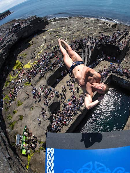 David Colturi of the USA dives from the 28-metre platform during the third stop of the Red Bull Cliff Diving World Series, Inis Mor, Aran Islands, Ireland