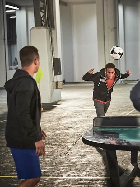 Neymar Jr heads football on to Ping Pong table.