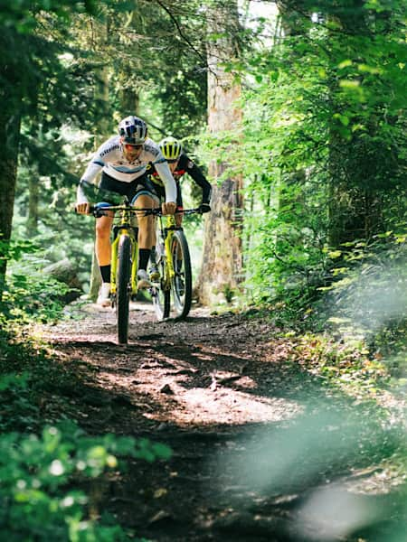 Lars Forster and Andri Frischknecht train on their cross-country bikes in Switzerland.