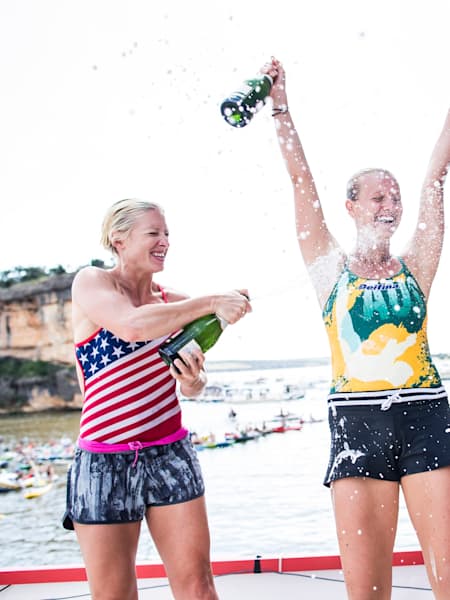 Cesilie Carlton, event winner Rhiannan Iffland, and Helena Merten celebrate during the first stop of the Red Bull Cliff Diving World Series, Possum Kingdom Lake, Texas, USA on June 4, 2016.