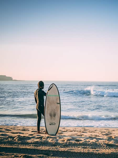 Surfer at Bondi Beach watching the line up