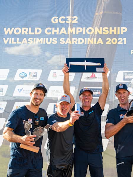 Red Bull Sailing and crew members Roman Hagara and Hans Peter Steinacher celebrating at the GC32 World Championship 2021 in Villasimius, Italy on September 19, 2021.