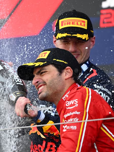 Race winner Max Verstappen & 3rd placed Carlos Sainz celebrate
