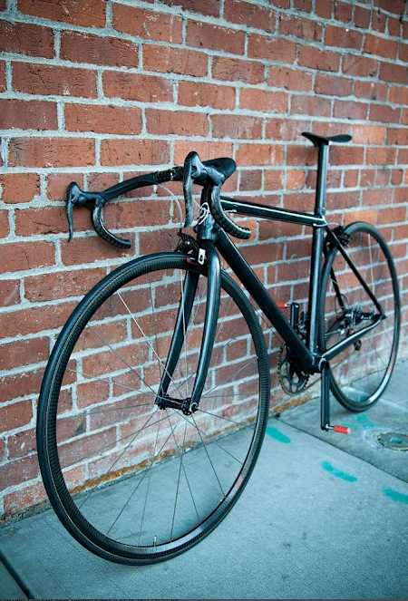 A close up of the handlebars and saddle on the world's lightest bike