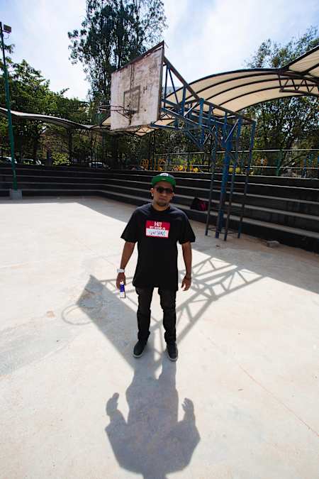 Rapper Gubbi poses for a photo at Baby Mona Basketball court in Koramangala in Bengaluru