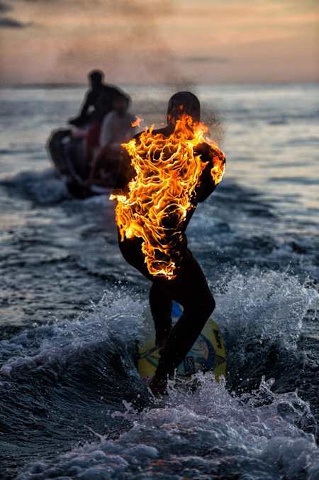 Jamie getting towed into Teahupo’o