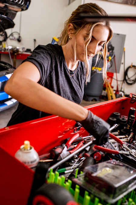 Emelia Hartford digging through her bunch of tools, ready to get working.