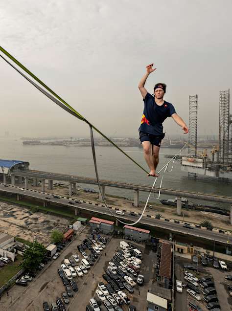 Jaan Roose highlines between Sterling Bank and Onome Oil Rig in Lagos , Nigeria on November 16, 2023