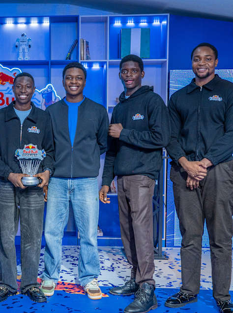 Finalists at the Red Bull Basement National Final Nigeria 2026 celebrate their achievement at The Zone, Gbagada, Lagos, proudly holding the winner's trophy on stage