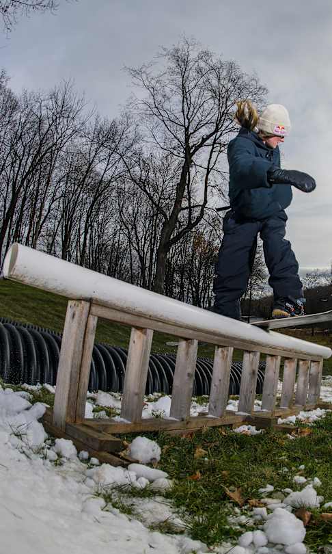 Grace Warner performs a frontside boardslide at Benny's Basecamp in St. Croix Falls, WI, on November 13, 2022. 