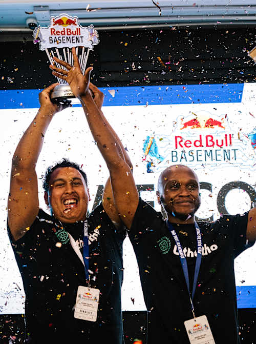 Uthutho triumph at the Red Bull Basement National Final 2026, raising their trophy amidst confetti at Innovation City in Cape Town, South Africa