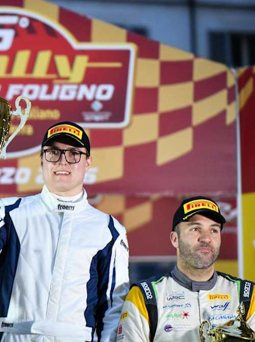 Korhola and co-driver Kristian Temonen celebrate victory in Italy