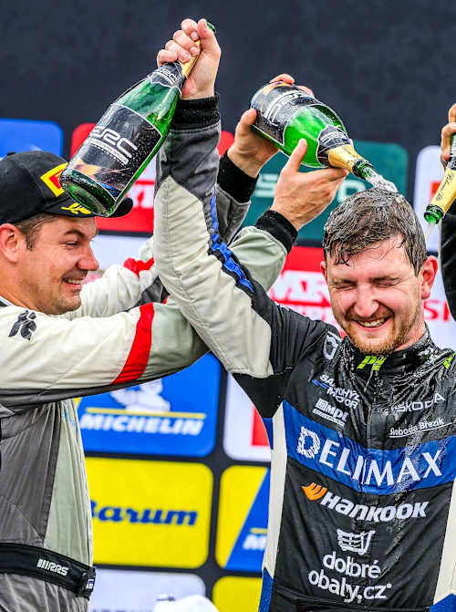 Suninen (left) and Mabellini (right) help Březík celebrate