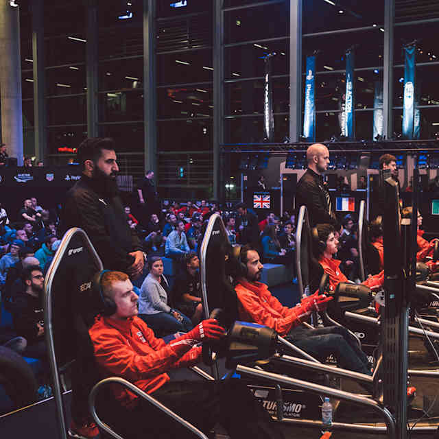 An image of gamers at the Gran Turismo Championship.