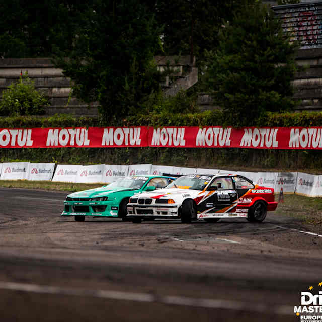 An image of two race cars at the Drift Masters European Championship.